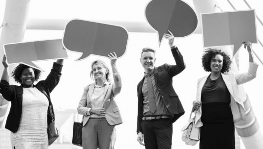 4 customers with speech bubbles above their head, emphasising how engaged they are.