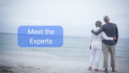 A retired couple on the beach.|